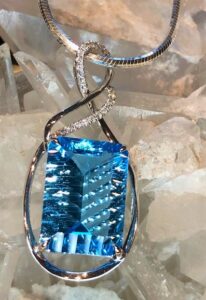 14k white gold blue topaz and diamond pendant 230-01198 $920