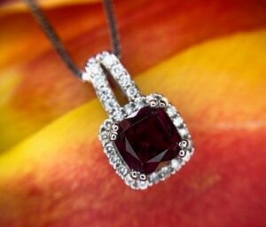 14k white gold garnet and diamond pendant