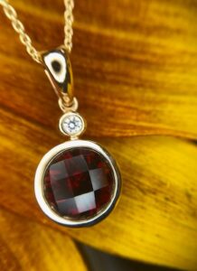 14k yellow gold garnet and diamond pendant 230-01231 $1010.00