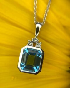 14k white gold blue topaz and diamond pendant 230-01232 $845